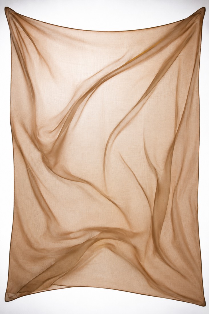 Scarf Silk-Blend Square held against a lightbox. The cloth reads as sheer.