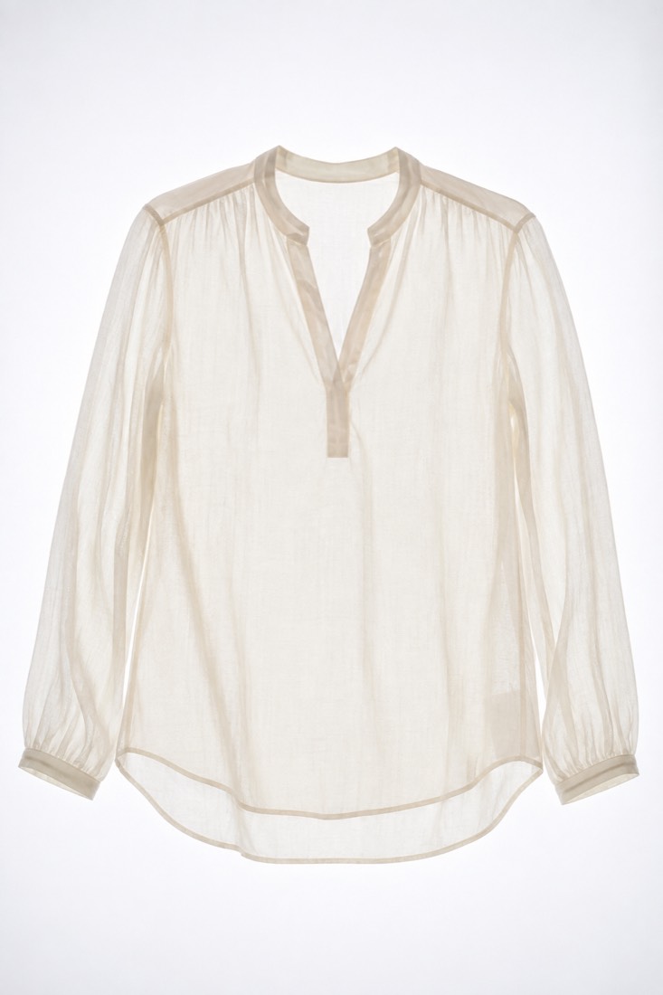 Silk-Blend Blouse photographed against a backlight so the opacity of the cloth is visible.