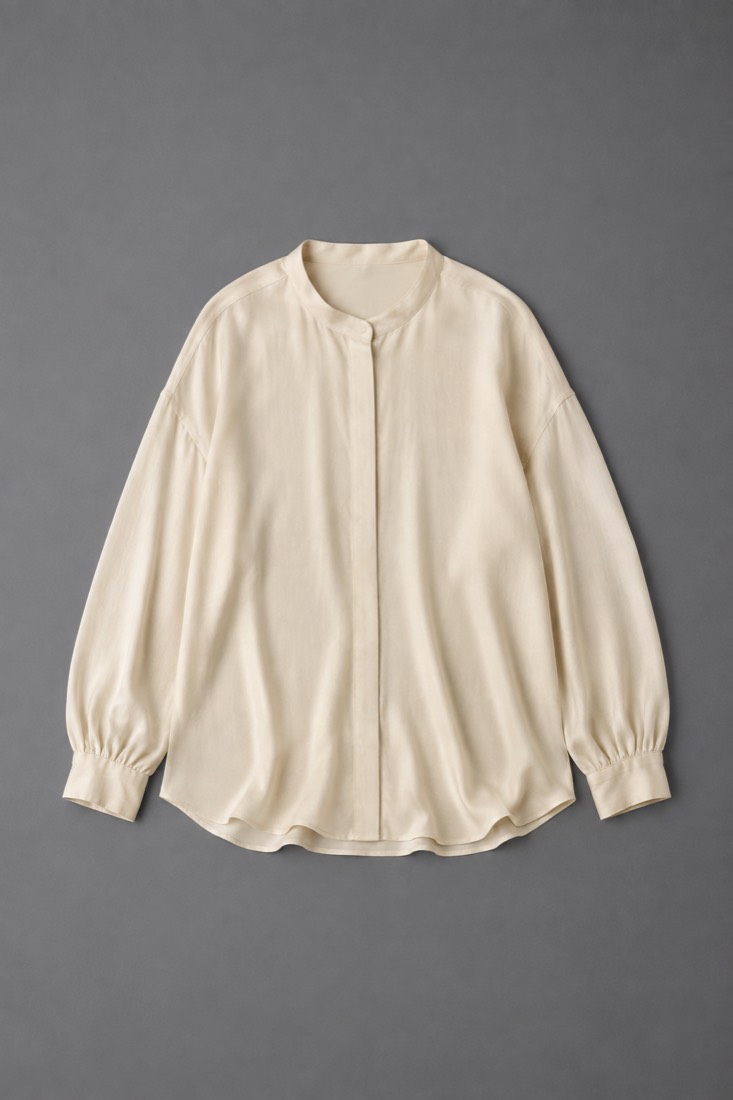 Silk-Blend Blouse in Oat White, laid flat.