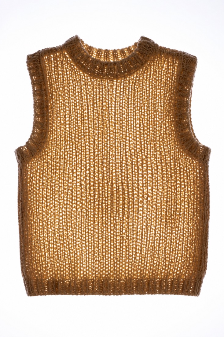 Sleeveless Knit Vest photographed against a backlight so the opacity of the cloth is visible.